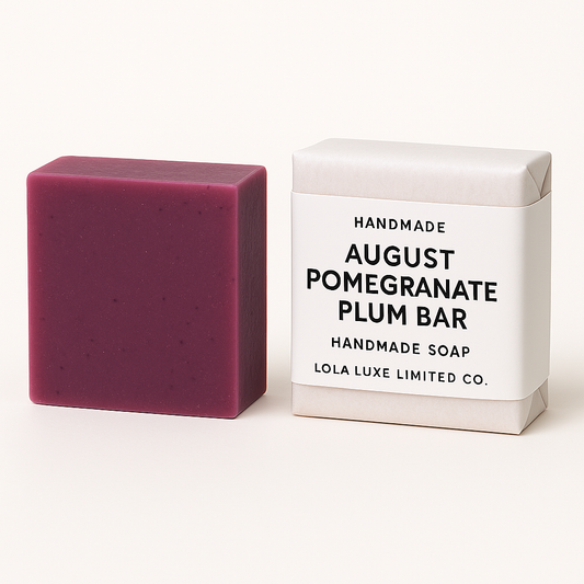 Purple handmade soap bar next to its packaging on a white background