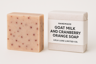 Goat milk and cranberry orange soap with packaging on a white background