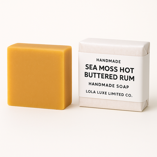 Bar of sea moss hot buttered rum soap next to its packaging on a white background