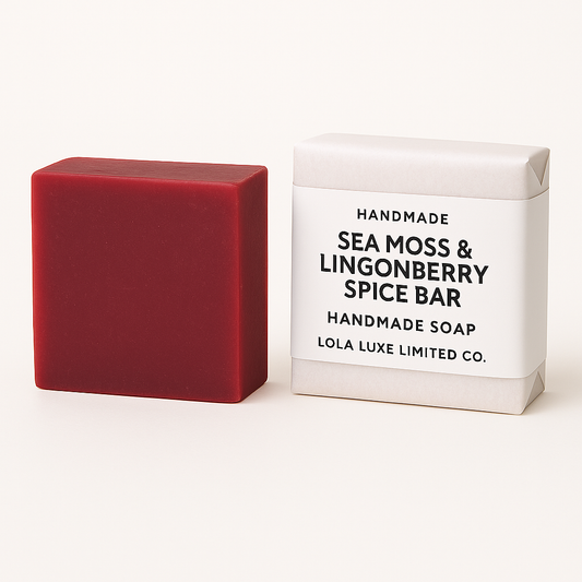 Red handmade soap bar next to its packaging on a white background